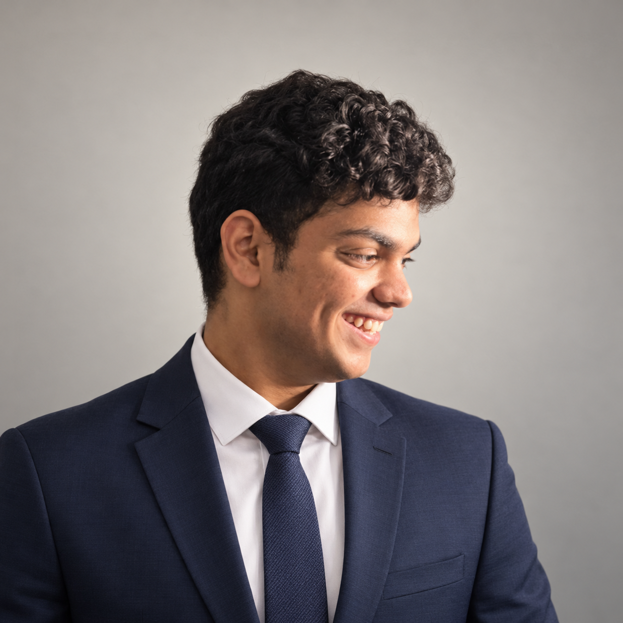 Kalmit Kulkarni in a navy suit